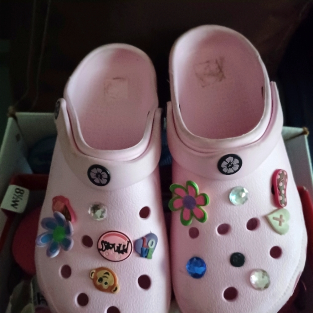 Pink slip on sandals with decorative buttons